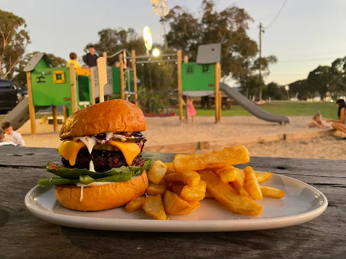Burger and chips served at Ballandean Pub, a family-friendly place to eat near Stanthorpe with a playground