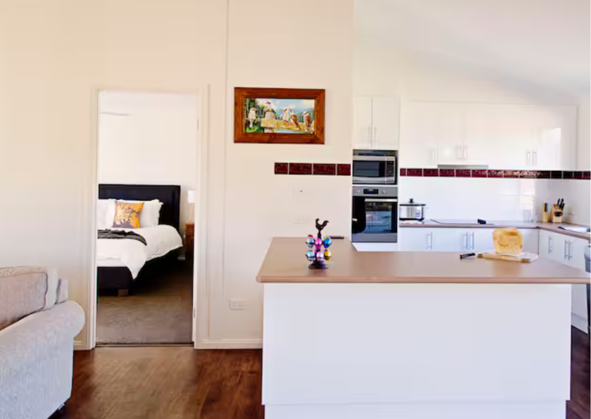 The modern, fully-equipped chef's kitchen with a large island bench at Country Homestead Retreats.